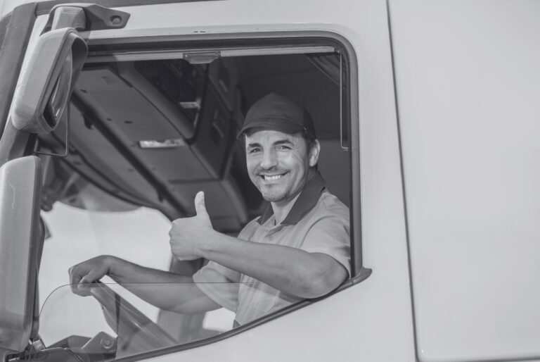 Truck driver who knows how to make a job offer giving a thumbs up