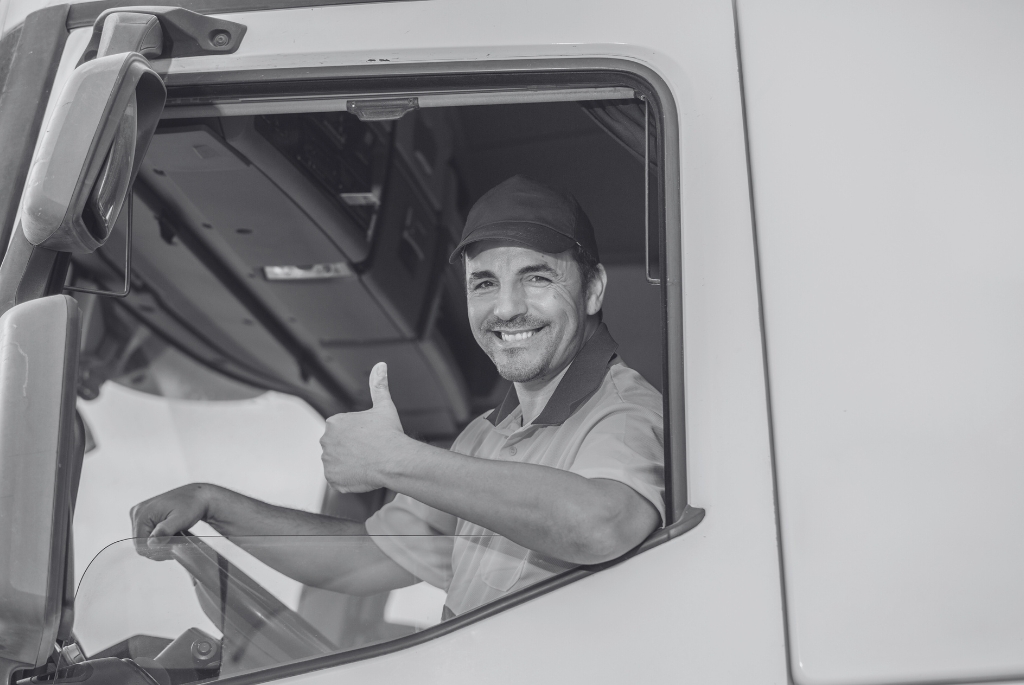 Truck driver who knows how to make a job offer giving a thumbs up