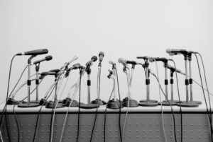 Microphones on table waiting for person to talk about employer branding