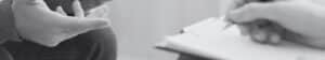Person holding clipboard and checking boxes on outsourcing readiness assessment