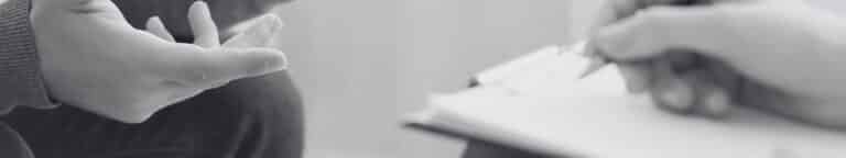 Person holding clipboard and checking boxes on outsourcing readiness assessment