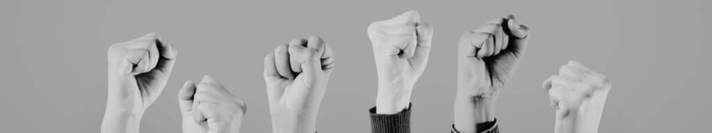 Line of fist held up in the air by internal recruiters resisting RPO